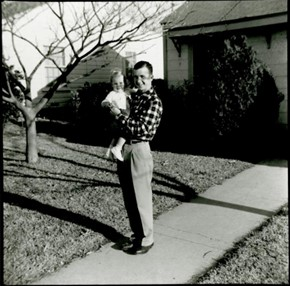 A Smiling Lee Harvey Oswald Holding His Young Daughter